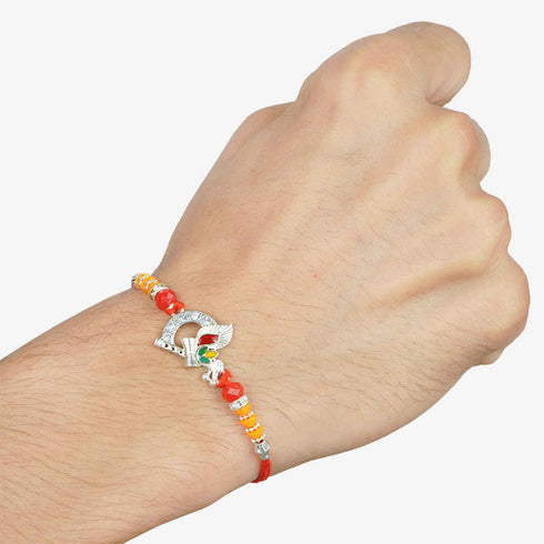 Bansuri Damroo Religious Rakhi - Uncommongifts.in