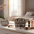 Makeup bag with 'MANINDER' branding on a vanity table with makeup items.