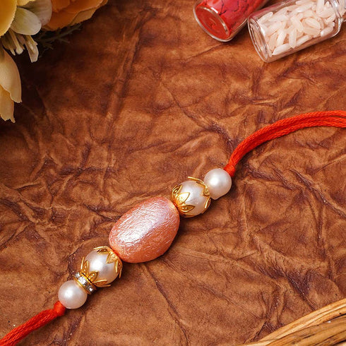 Pink Statement Pearl Rakhi - Uncommongifts.in