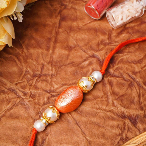 Copper Statement Pearl Rakhi - Uncommongifts.in