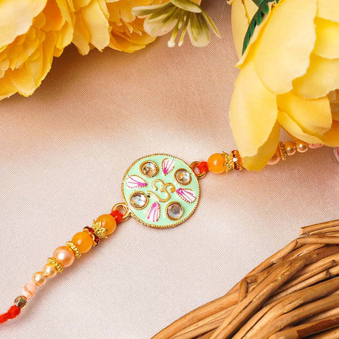 Om Mint Green Crystal Rakhi - Uncommongifts.in