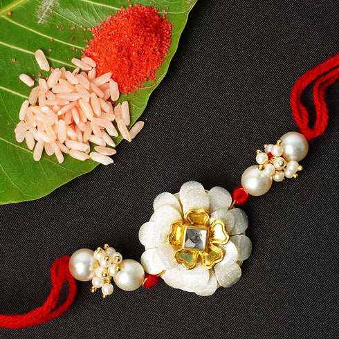 Crystal Centered White Rose Red Thread Rakhi - Uncommongifts.in
