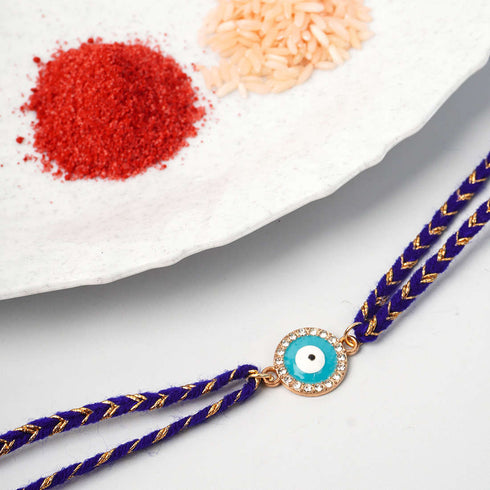 Sky Blue Round Evil Eye Rakhi - Uncommongifts.in