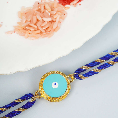 Gold Lined Sky Blue Disk Evil Eye Rakhi - Uncommongifts.in